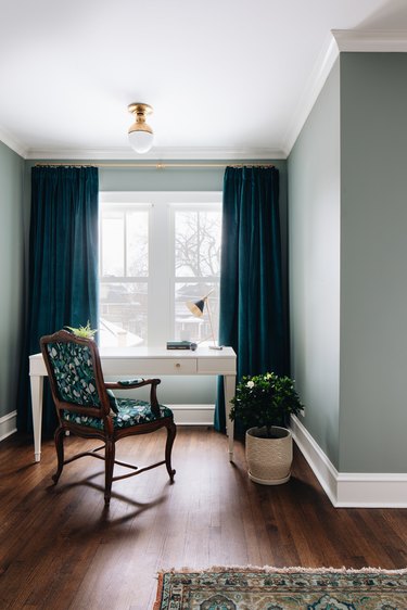 blue gray walls with dark teal curtains