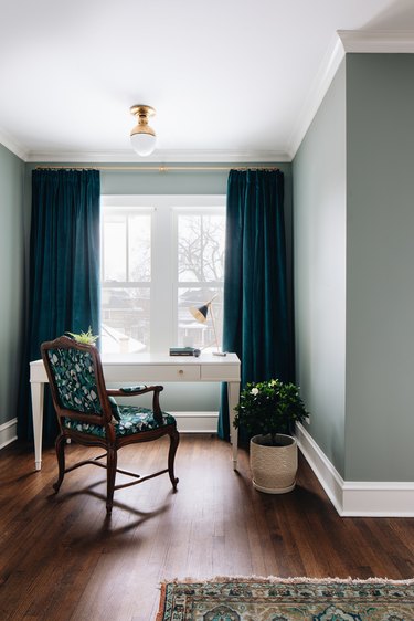 corner bedroom layout idea with white desk with blue curtains in bedroom office