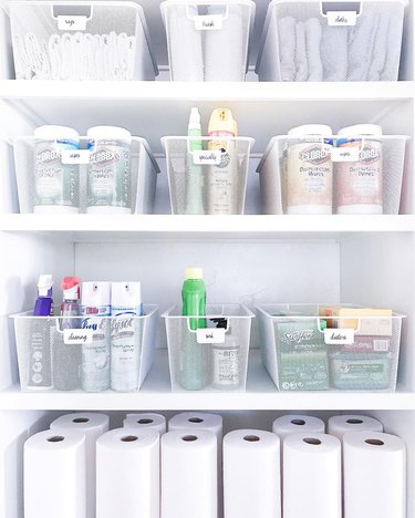 Cleaning Closet storage idea  full of supplies in wire baskets