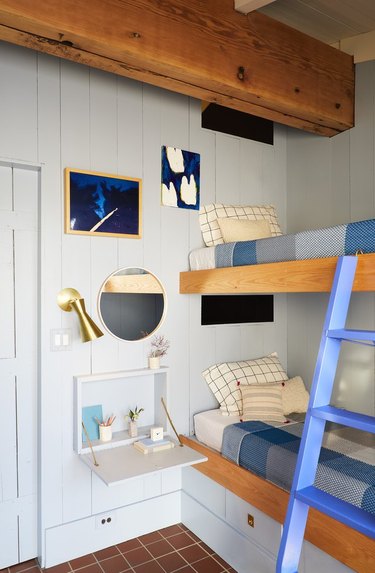 whimsical farmhouse bedroom with bunk beds and shiplap walls