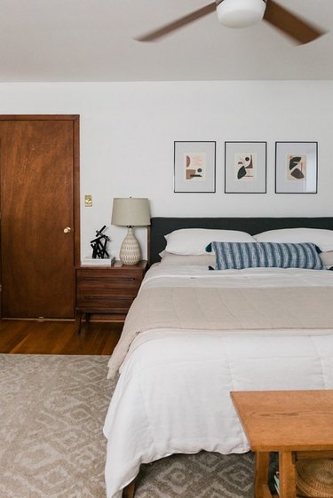 Midcentury modern bedroom style with low-height headboard and wood nightstands