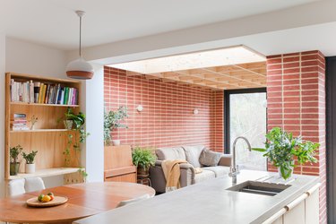 red brick wall in open concept floor plan