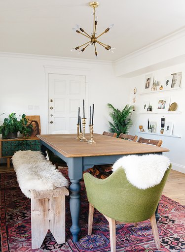 contemporary dining room with antique buffet and rustic bench