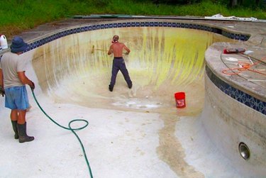 Acid washing a pool.