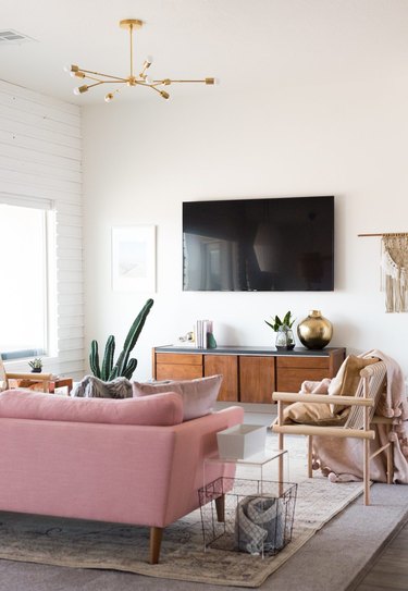 pink boho living room lighting idea with semi-flush pendant