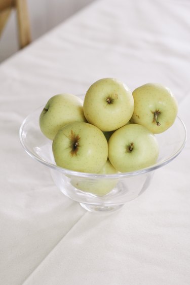 Bowl of yellow apples