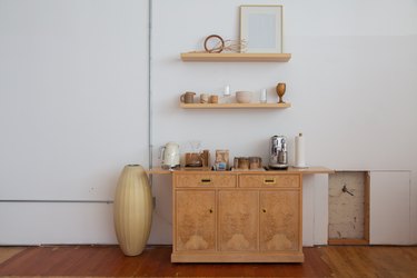 shelves and cabinet with cups and kitchenware