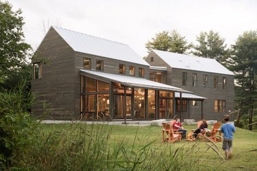 Modern farmhouse with a timber roof and expansive windows