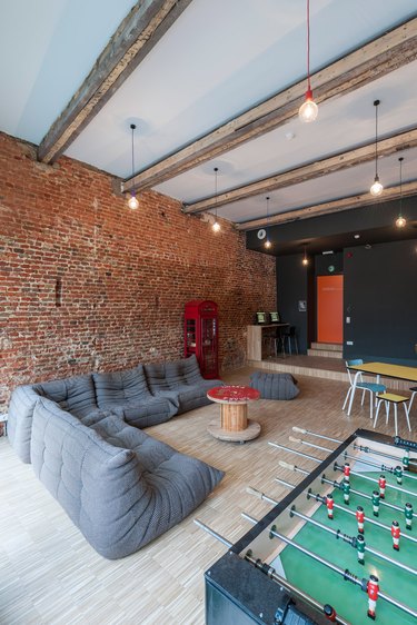 industrial garage game room ideas with sofa and table football