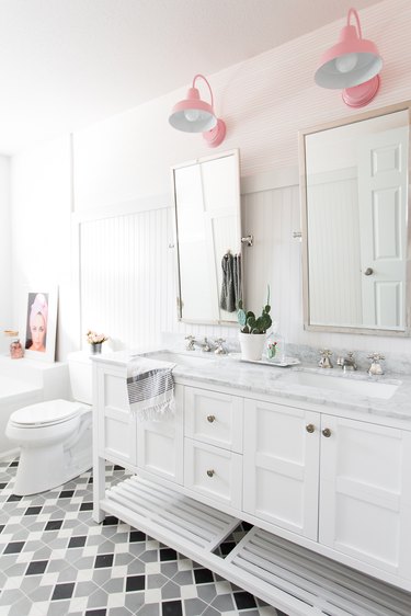 A bathroom with pink lighting