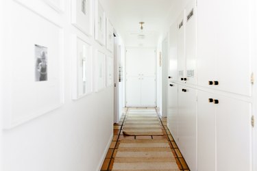 Hallway Runner Ideas in Hallway with white cabinets, tile floor, jute runners.