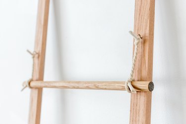 Attach the ladder rungs to the hanging rope pieces.