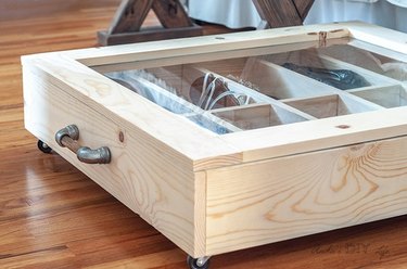 A shoe divider beneath a bed