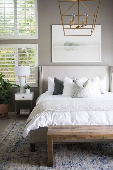 White shutter contemporary window treatments in a bedroom by Becki Owens