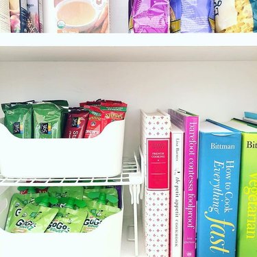 How to Organize a Pantry with Pantry with snack bins and cookbooks