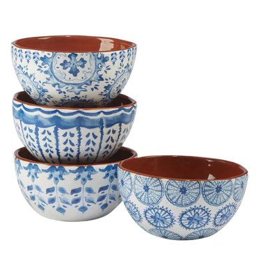 four blue and white bowls