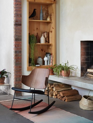 Design Within Reach contemporary rocking chair near fireplace