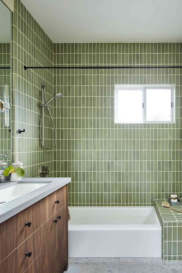 contemporary shower with green vertically set tiles