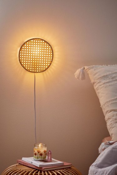 Lexi Rattan bedroom wall sconce from Urban Outfitters