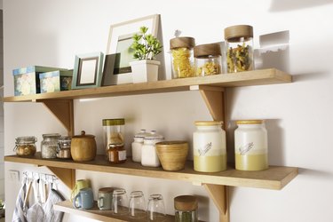 wooden shelf and containers on the wall