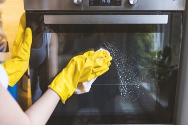 Girl polishing kitchen