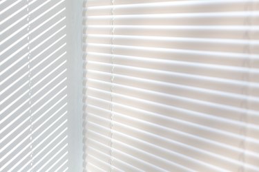 Venetian blinds background with sun light
