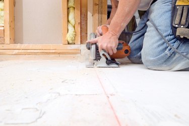 Circular Saw Cutting Subfloor for House Remodeling Project