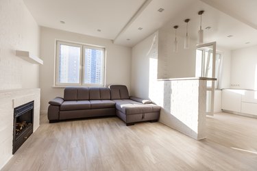 Modern, stylish living room with big gray sofa