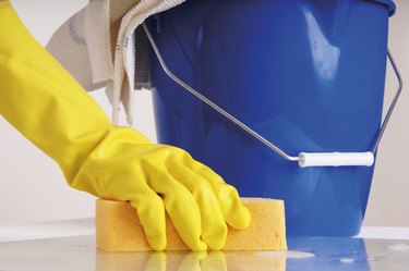 Person cleaning with sponge