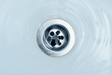 Water flow into drain in bath