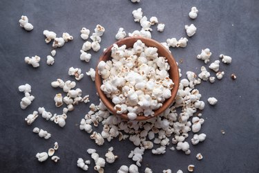 high angle view of popcorn in a bowl on a gray background