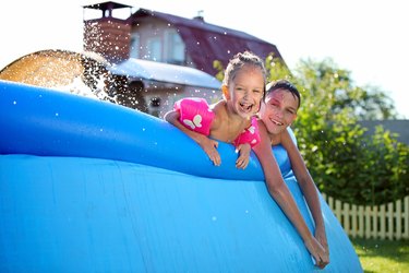 Kids having fun in a inflatable swimming pool