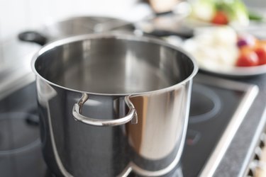 Blanching vegetables in large cooking pot preparation