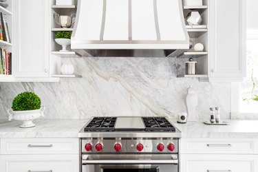Classic White kitchen with gas stove.