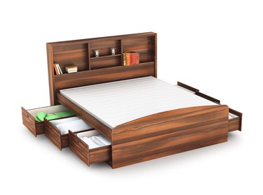 wooden bed with open drawer