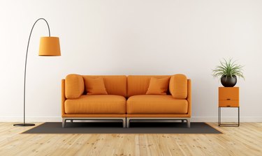 Cushions On Sofa At Home Against Wall