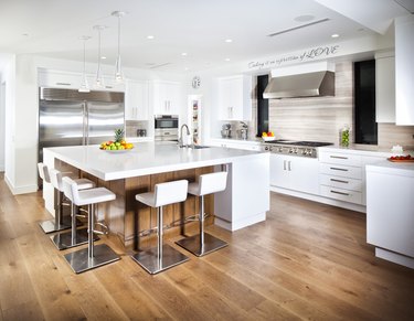 White kitchen with hardwood floor
