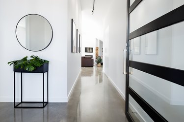 Contemporary home entry hall with polished floors