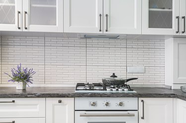 Modern white kitchen interior, front view