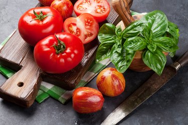 Fresh ripe garden tomatoes and basil.