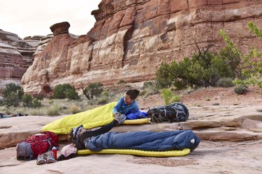 Women in sleeping bags while camping in Canyonlands National Park, Moab, Utah, USA