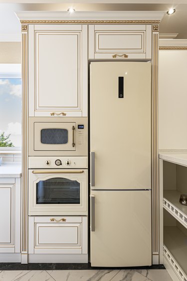 Neoclassic-style luxury kitchen interior with island