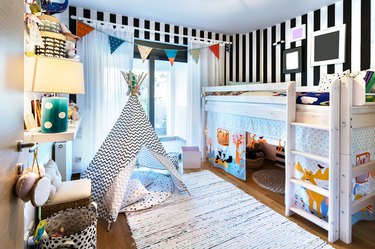 Kid bedroom with teepee and bunk bed.