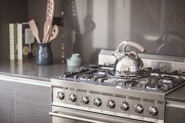 Installing stainless steel kitchen backsplash!