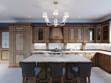 Cherry furniture kitchen island details and bar chairs.