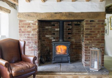 Armchair and fireplace in living room