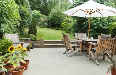 Patio with garden furniture and parasol