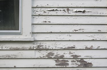 Peeling white paint on siding