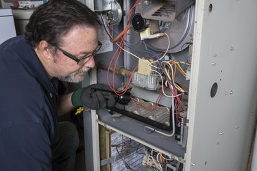 Technician Checking a Gas Furnace