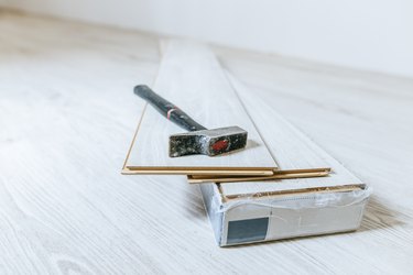 Hammer on sheets of wood laminate floor